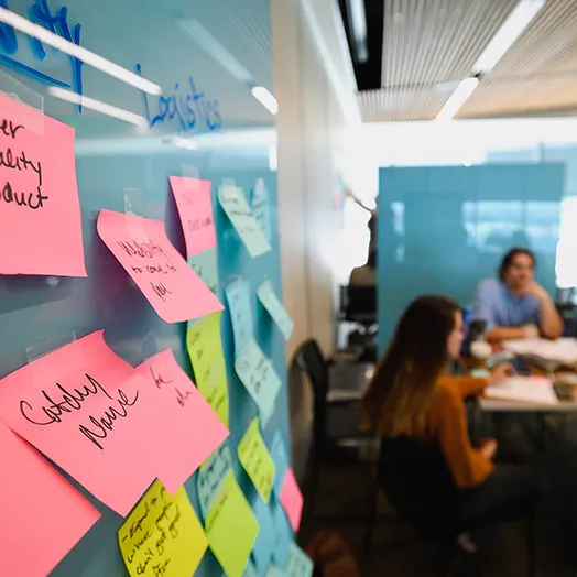 sticky notes on board in a classroom