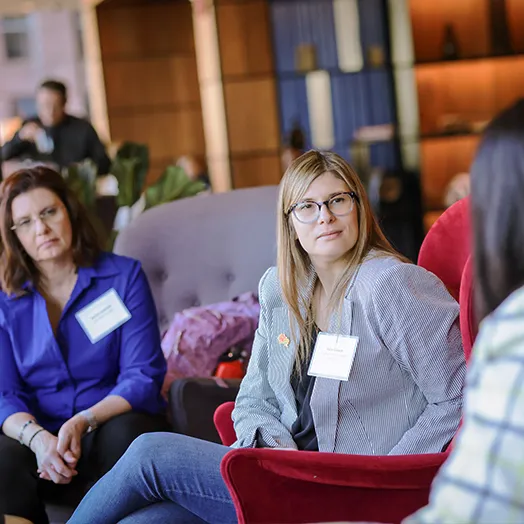 two businesswomen at a conference